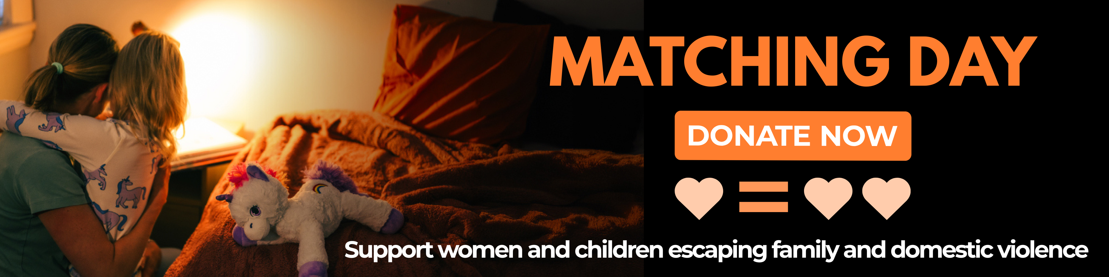 Mother holding a young child at night beside the Women’s Community Shelters “Safety Can’t Wait” Safe Beds Save Lives EOFY donation campaign banner